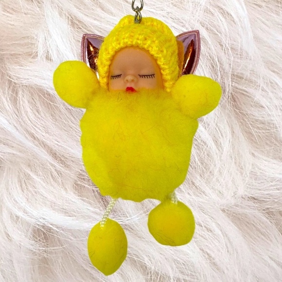 SLEEPY BABY WITH FAIRY WINGS SMALL POMPON IN YELLOW KEYCHAIN CHARM - Picture 1 of 6